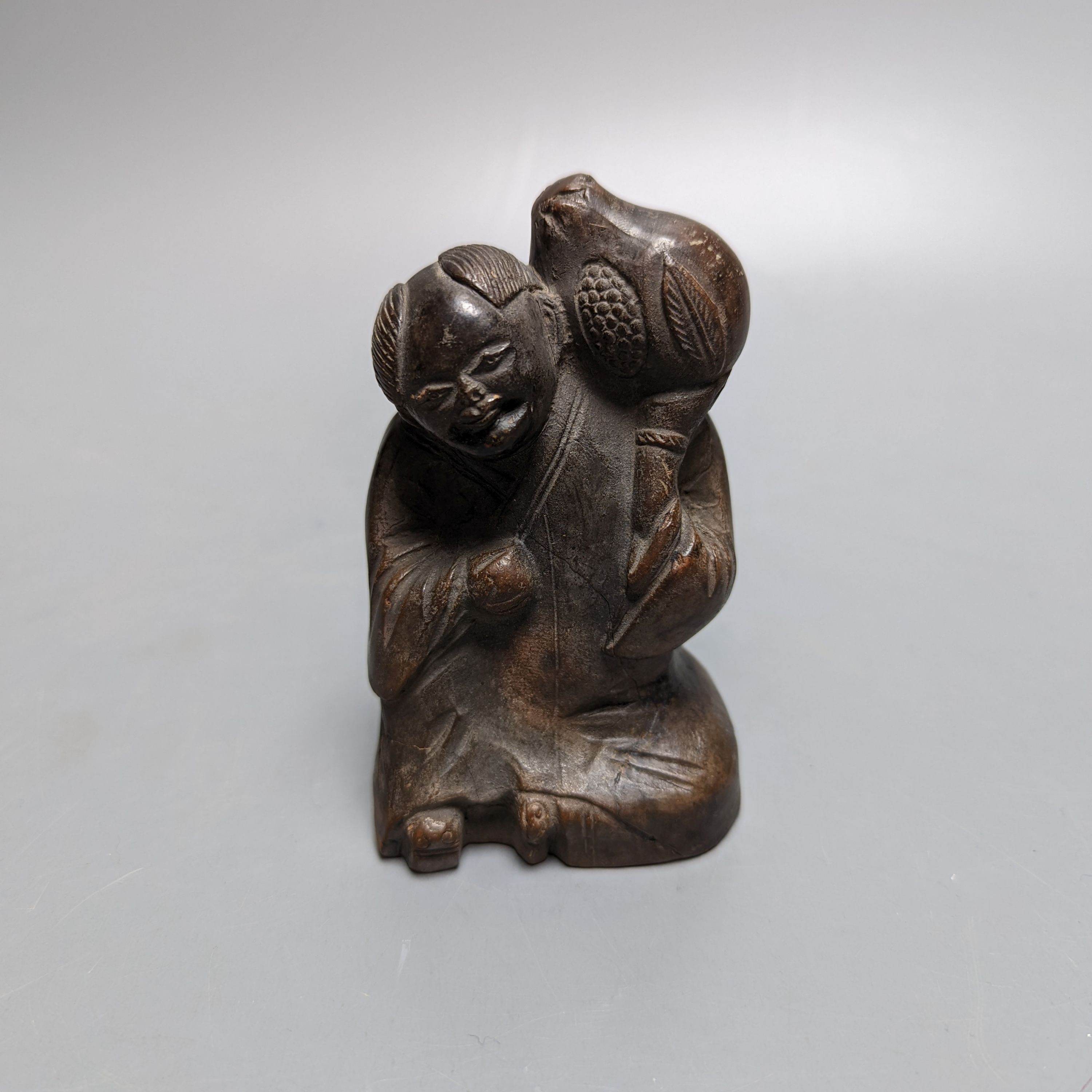 A late 19th/early 20th century Chinese pottery figure, 9.5cm impressed maker’s mark